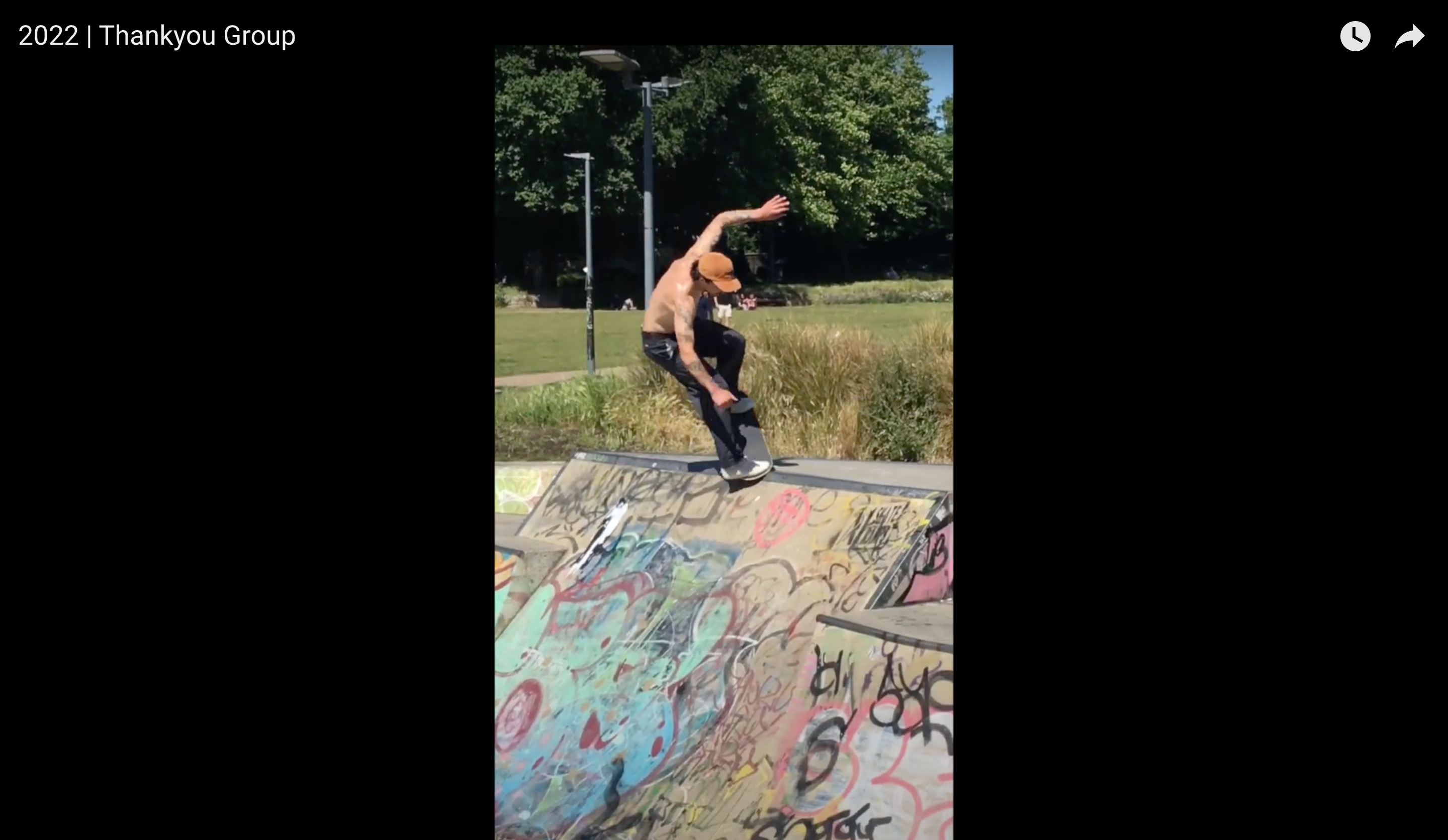 Load video: skateboarder doing an indy grab transfer in a bowl